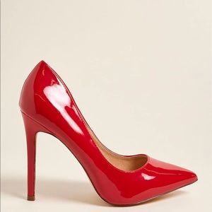 Red patent leather pumps